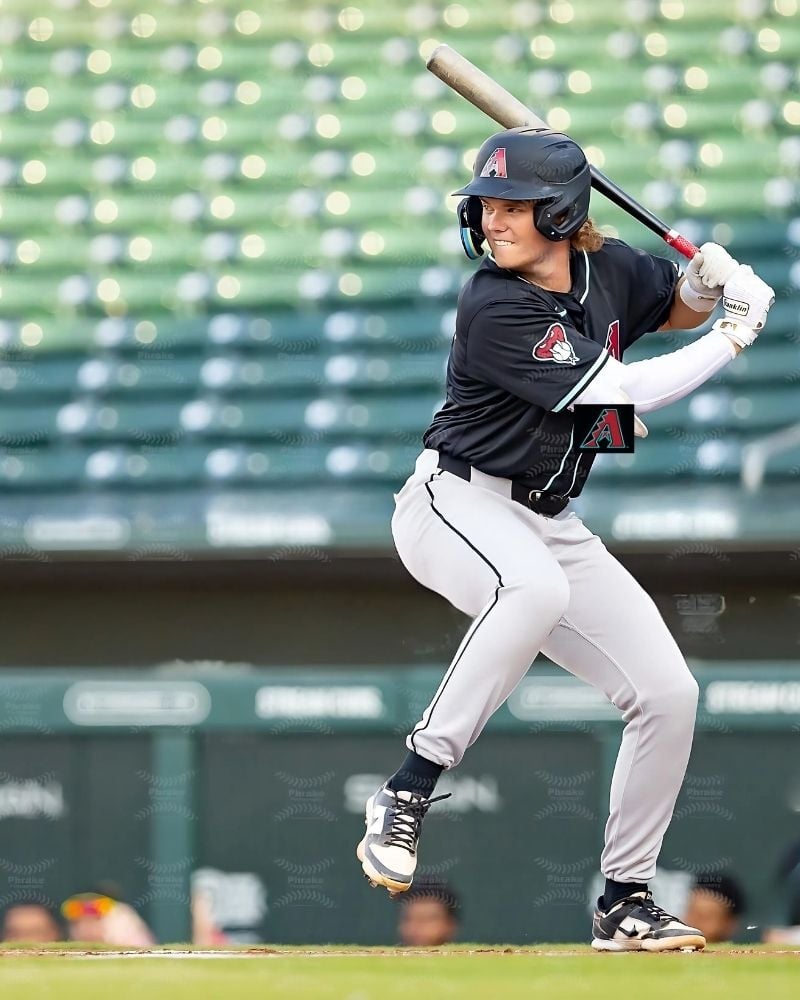 Arizona Diamondbacks player Ben McLaughlin in a batting stance during a professional game, illustrating the Play More results of the program.