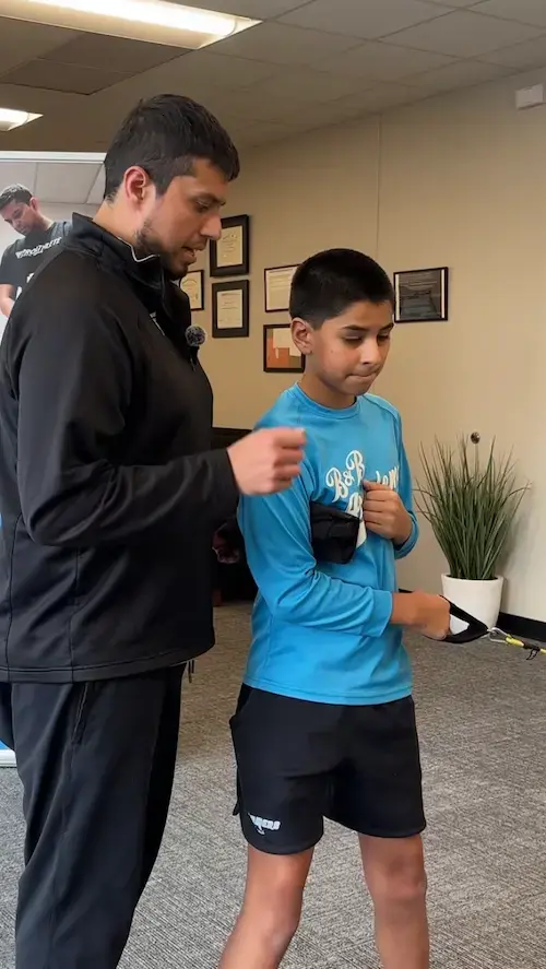 Baseball physical therapist treating youth pitcher elbow at PRO Athlete Physical Therapy in Centennial, Colorado Baseball physical therapist treating youth pitcher elbow at PRO Athlete Physical Therapy in Centennial, Colorado