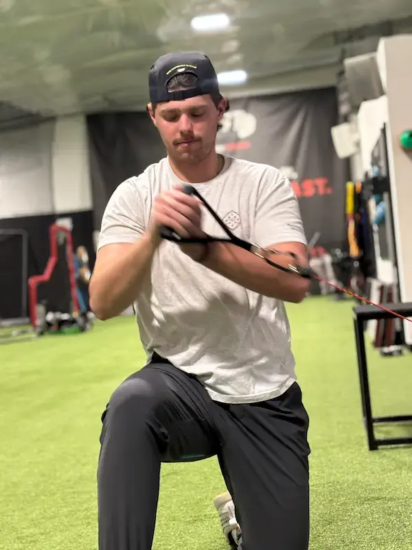 Professional pitcher Blake Hammond completing band work after game active recovery for pitchers Denverth PRO Athlete Physical Therapy during a recovery session